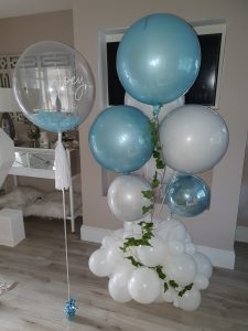 Blue and white personalised balloon display