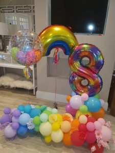 8th birthday rainbow balloon display