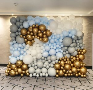 Blue, grey, white and gold balloon backdrop wall