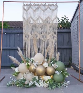 Balloon and flowers backdrop with string decoration