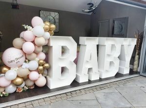 pink, gold and white balloons with giant baby letters