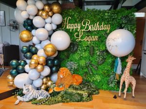 safari themed backdrop and balloon animals