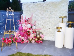 flower backdrop, balloons and stands